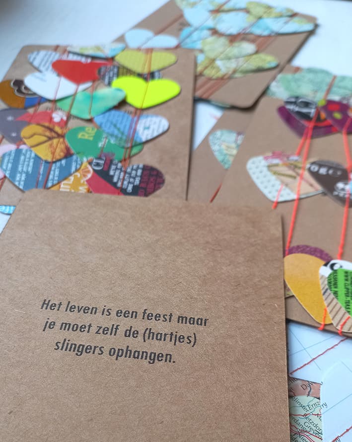 "het leven is een feest" kaart van de hartjesslingers